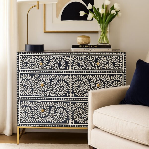 Elegant black Sheesham wood chest of drawers with intricate white bone inlay vine pattern and golden legs