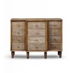 Handcarved Sheesham wood sideboard cabinet with intricate drawer designs in a cozy modern living room setup