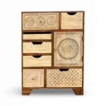 Eclectic multi-drawer wooden cabinet with hand-carved floral and geometric patterns