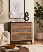 Modern three-drawer dresser with cane front and black wood finish, perfect for minimalist interiors.