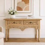 Handcrafted Sheesham wood console table with intricate floral carvings, showcasing craftsmanship and elegance for traditional interiors.