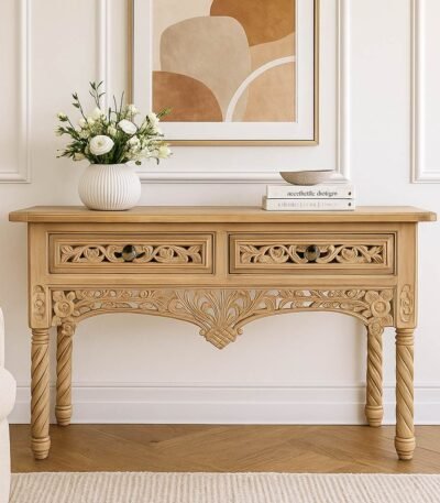 Handcrafted Sheesham wood console table with intricate floral carvings, showcasing craftsmanship and elegance for traditional interiors.