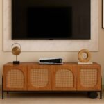Handcrafted Sheesham wood TV cabinet with arched cane weave doors and unique curved side design