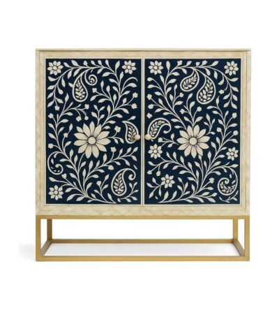 Elegant modern bar cabinet with navy blue interior, gold base, and liquor display, styled with flowers and a designer lamp in a luxury living room.