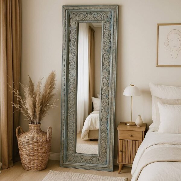 Tall vintage-style Sheesham wood mirror with detailed handcarved floral patterns, ideal as a statement hallway or dressing mirror.